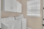 The laundry room with full size washer and dryer